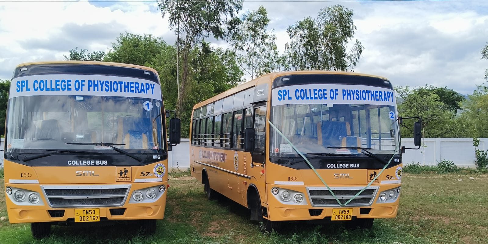 Two yellow SPL College of Physiotherapy buses parked on the campus grounds